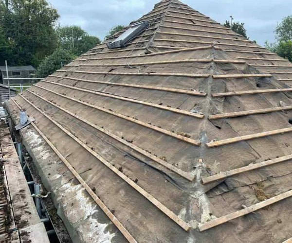 This is a photo of a hip roof that has been stripped back to the battens, and is awaiting a new roof covering to be installed. Works carried out by DHT Roofing Cudworth